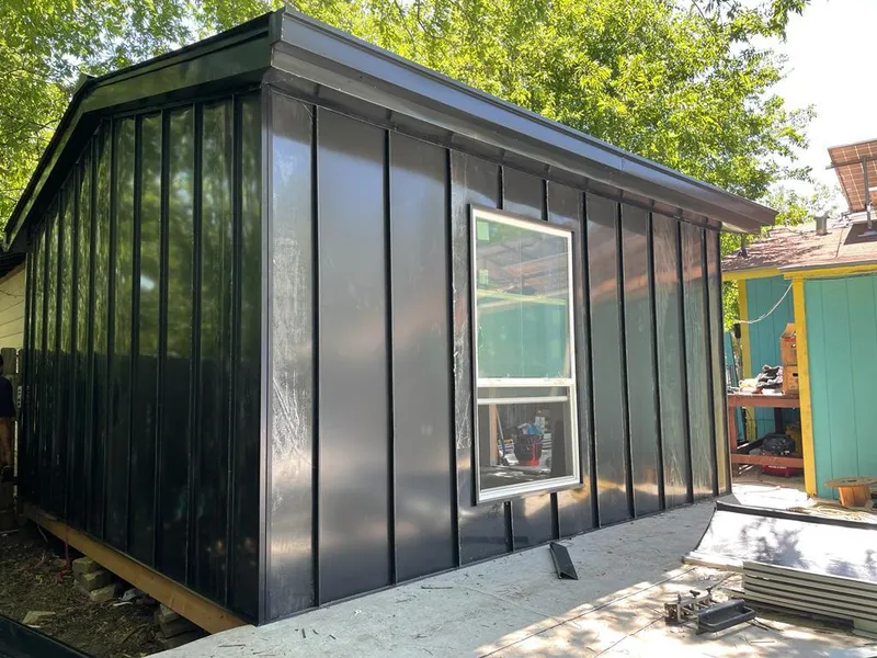 Black standing seam metal wall panels for Roof Inspection in Delphos